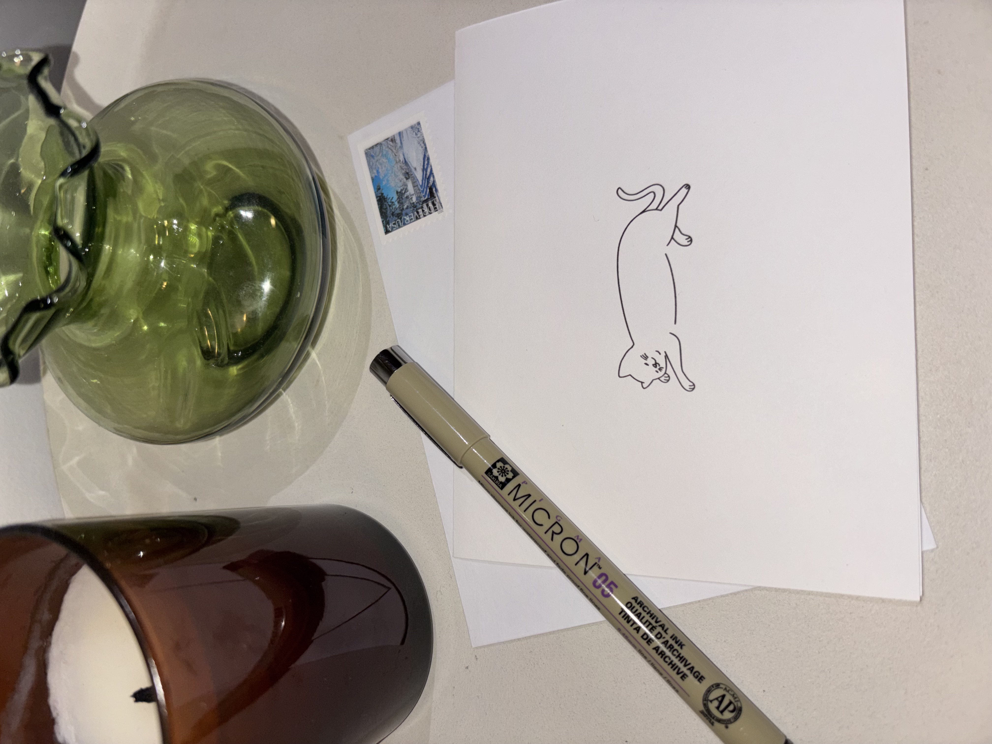 Postage Club card with vases and pen